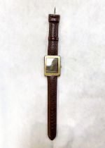 An Omega Deville Gentleman's wristwatch with rectangular deep brown dial with gold hands and baton