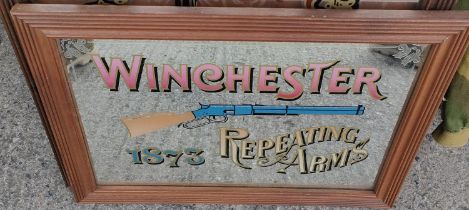 A reproduction Winchester Repeating Rifle advertising mirror, 37 x 55cm