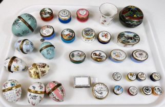 A collection of Bilston and other painted enamel pots, eggs etc