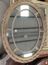 A Georgian style oval gilt framed and mounted wall mirror; a pair of gilt framed "Old Master"