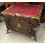 A brass mounted oak box seat/stool; a fireside companion set