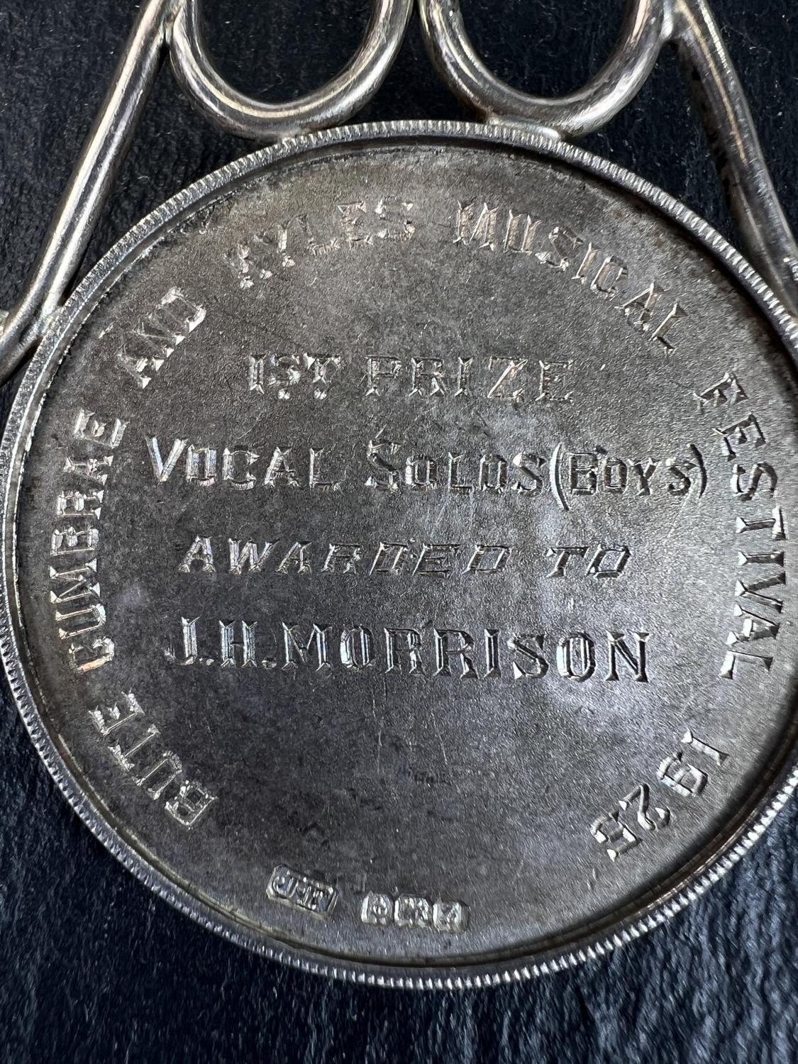 A hallmarked silver musical medal, Apollo and his lyre to the front and inscription Bute Cumbrae and - Image 3 of 3