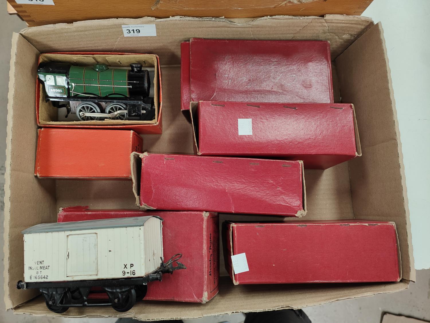 An originally boxed Hornby 0 gauge tin plate clockwork locomotive and tender; 5 boxed 0 gauge