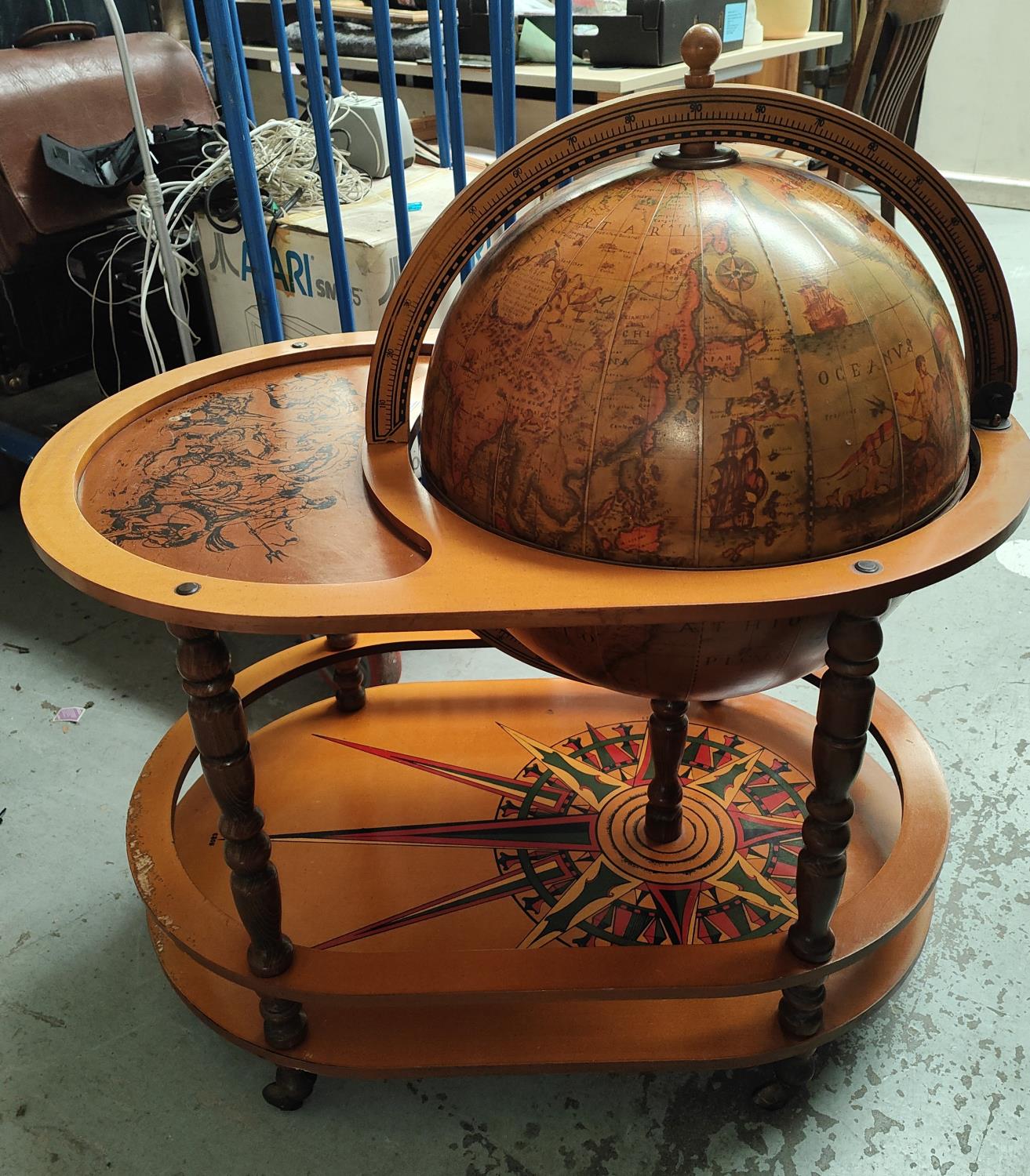 A reproduction 16th century globe/drinks trolley