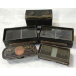 An early 20th century stereoscope viewer and 3 boxes of glass viewing slides and a "Patheorama"