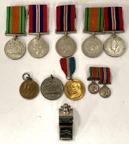 A collection of pairs of World War II medals, a pair of miniatures, whistle etc