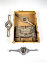 Three Rolex Oyster case back openers and a vice