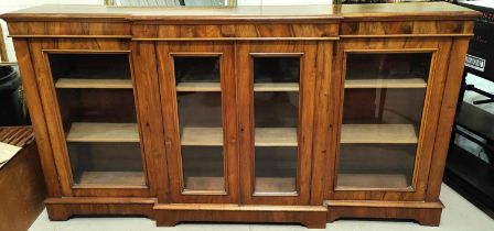 A Victorian walnut breakfront side cabinet enclosed by 4 glazed doors on plinth base, length 198cm