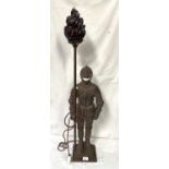 A "Knight in Armour" floor standing cast metal lamp