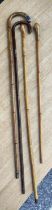 Four WWI period officers' canes, one with silver collar, one with silver tip