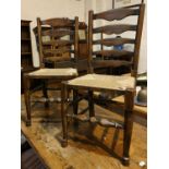 A set of four good quality oak dining chairs with rush seats, turned legs etc and another similar