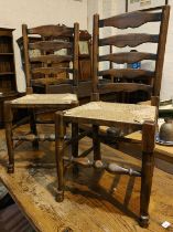 A set of four good quality oak dining chairs with rush seats, turned legs etc and another similar