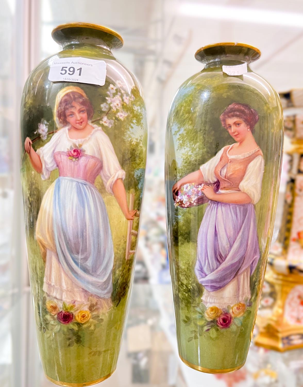 A pair of Royal Bonn porcelain vases of baluster form, hand painted with young women with flowers in