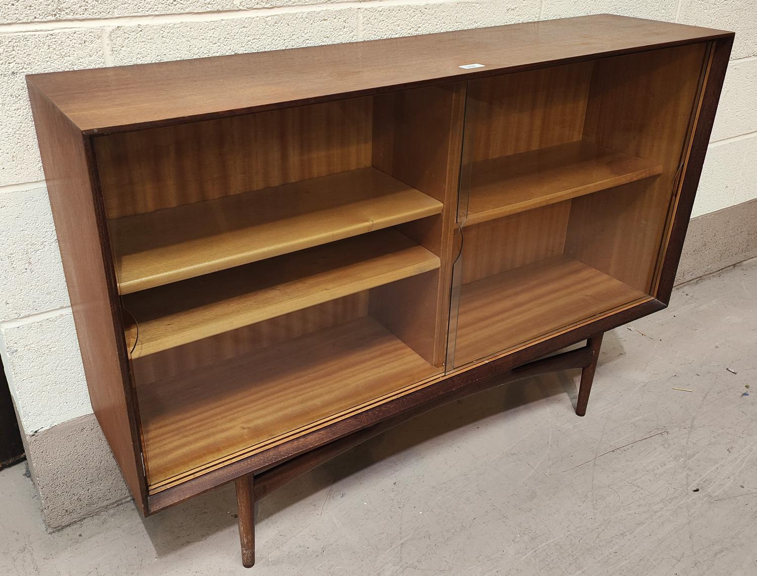 A 1960's G-Plan style teak side cabinet by Dalescraft enclosed by 2 sliding doors