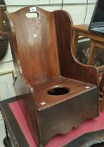 A 19th century mahogany childs rocking commode chair