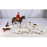 A Beswick Fox Hunting set of huntsmen, 8 hounds and 2 foxes