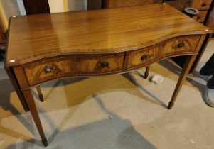 A reproduction mahogany side table fitted for cutlery