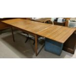 A G-Plan style 1960's rectangular teak draw-leaf dining table
