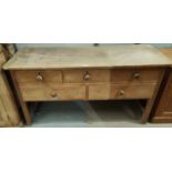 A Victorian stripped pine dresser base of 3 short and 2 long drawers