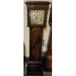 An early 20th century oak longcase clock with barley twist columns to the hood, with square brass