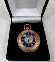 A chased yellow metal hunter fob watch with blue enamel decoration, white dial and backplate stamped
