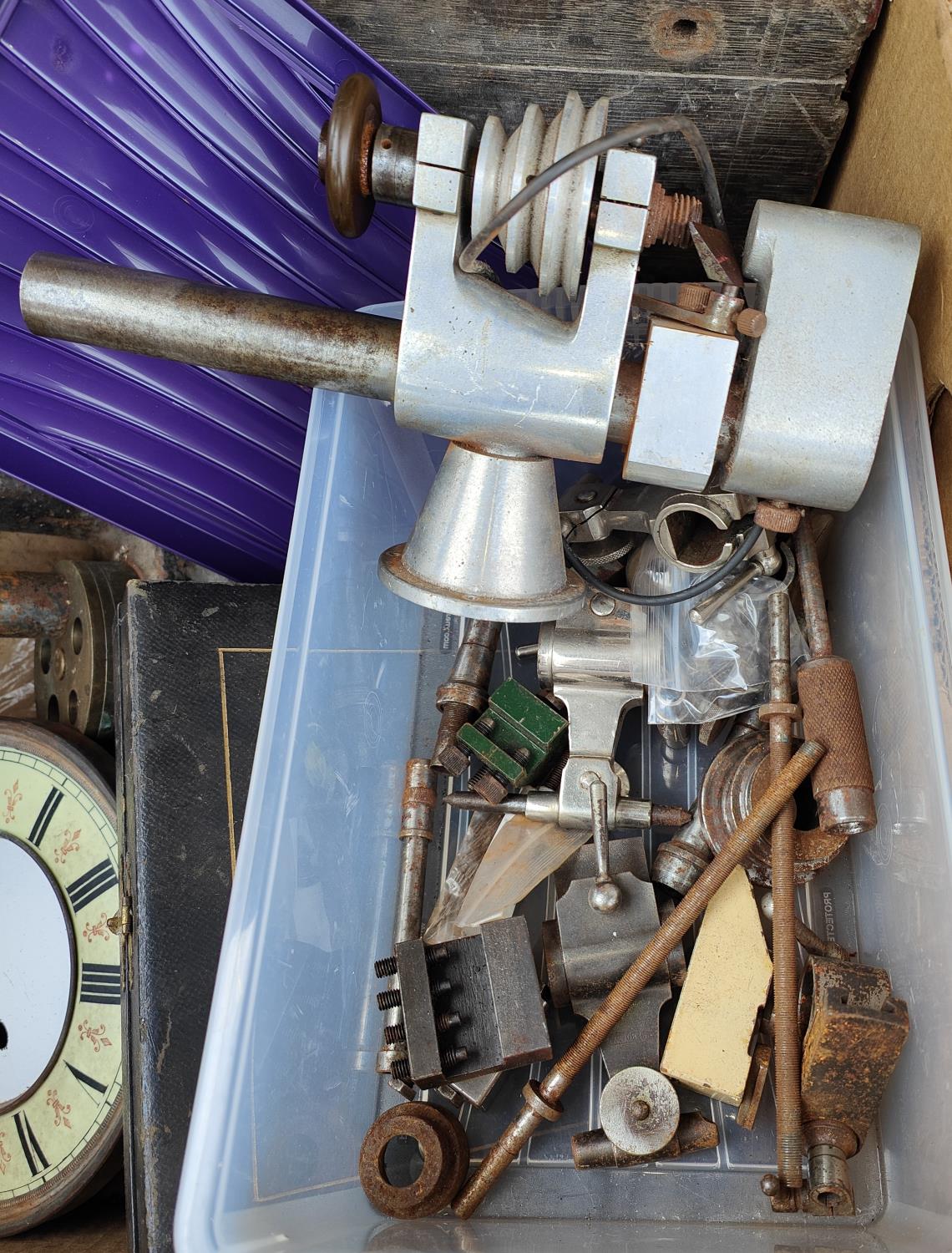 A vintage watch makers lathe, clock and watch parts including single weight driven