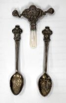 Two white metal Rolex Bucherer teaspoons with Rolex crown finials and a white metal and mother of