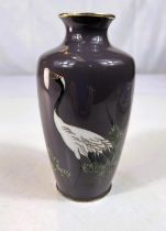 A Japanese Ando Factory cloisonne vase with heron decoration on grey background, signature to