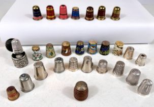 A selection of thimbles - cloisonnee, enamels etc, including embossed white metal thimble case