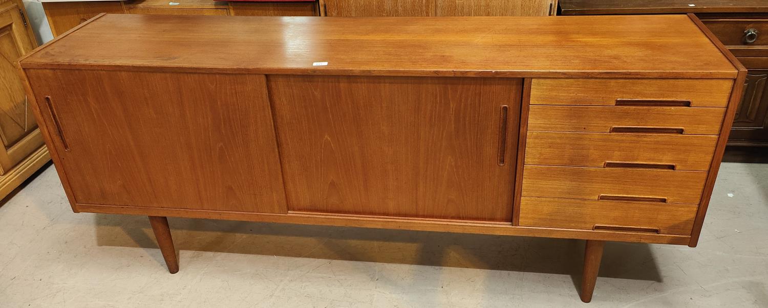 A 1960's G-Plan style teak sideboard with 2 sliding doors and 4 drawers