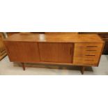 A 1960's G-Plan style teak sideboard with 2 sliding doors and 4 drawers