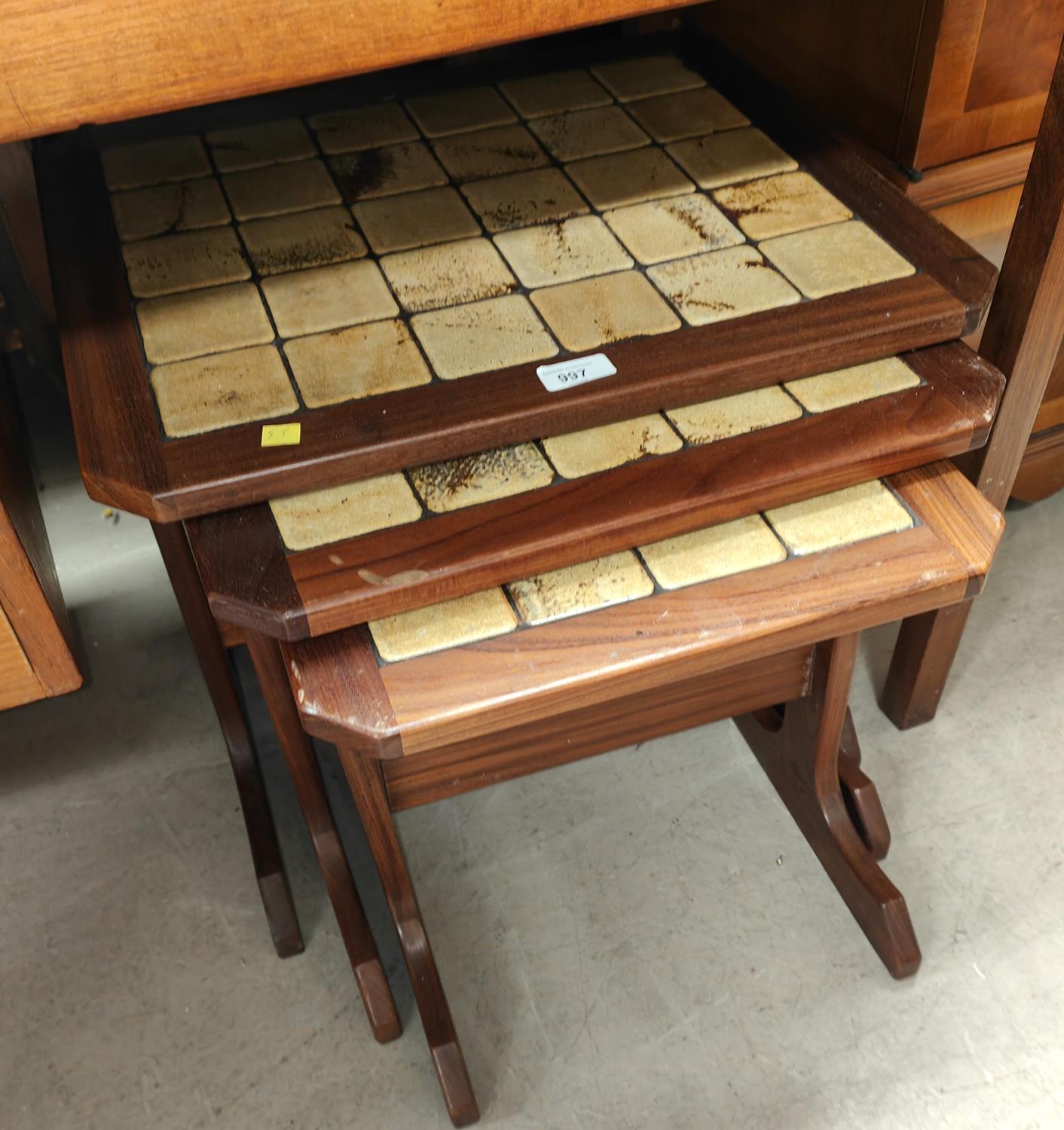 A nest of 3 1970's G-Plan style teak occasional tables with tile tops