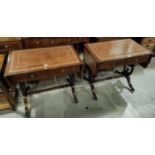 A pair of reproduction mahogany sofa tables with inset leather tops on lyre ends and splay feet