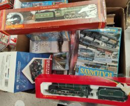 Two boxed Hornby 00-guage locomotives, and a collection of hardback books on trains etc