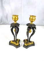 A pair of 19th century gilt and bronze candle sticks on three bird shaped supports