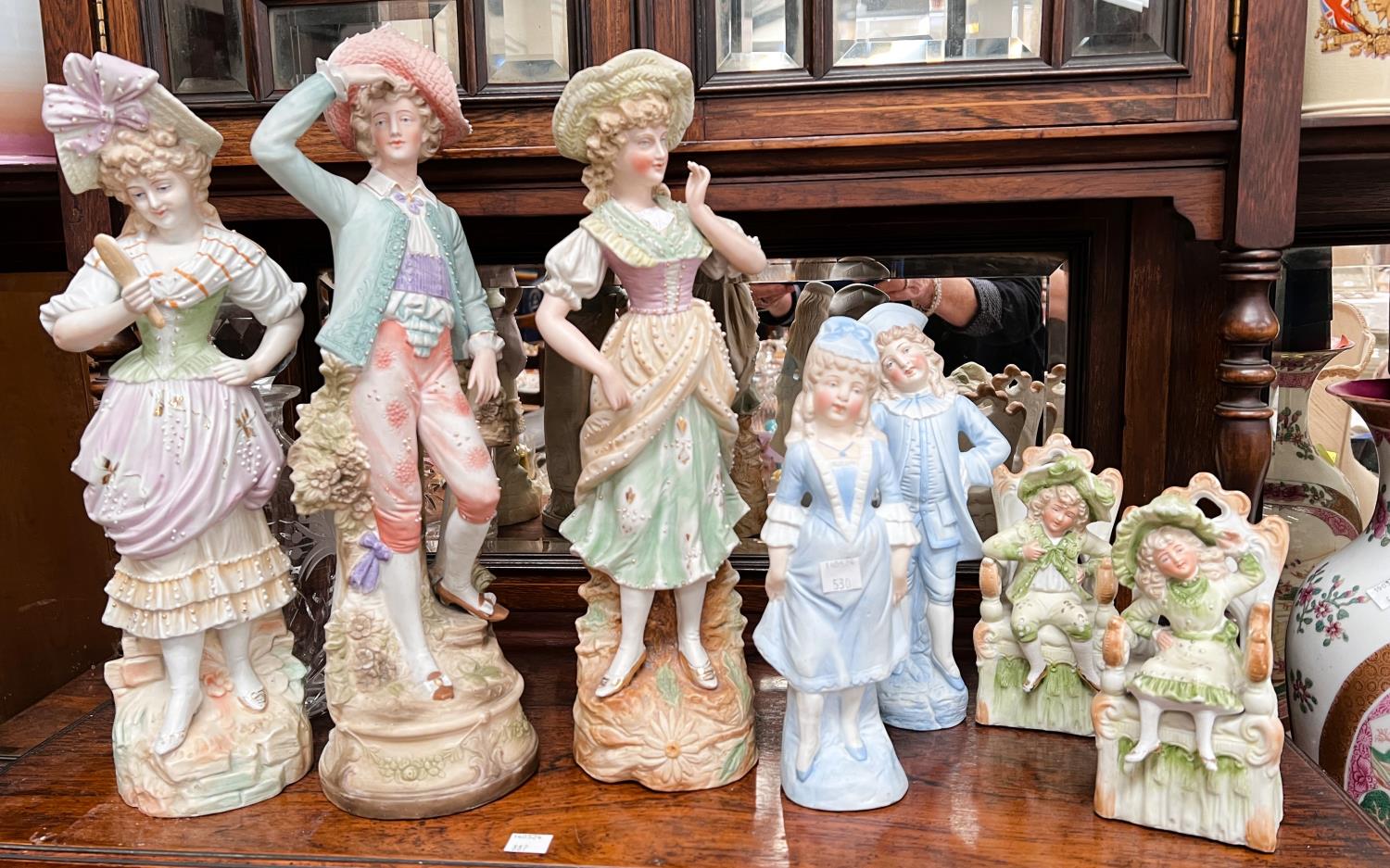 Three pairs of Victorian coloured bisque figures and a  single Victorian coloured bisque figure