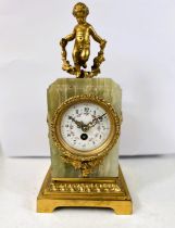 A 19th century French Ormolu mantel clock with gilt cherub decoration