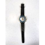 A vintage Aseikon gents wristwatch with rotating inner blue bezel on Tropical strap