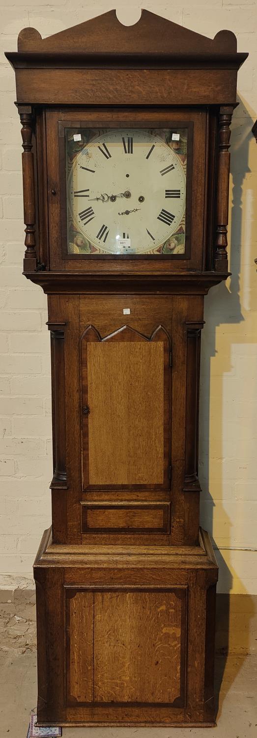An early 19th century oak and mahogany longcase clock with architectural pediment and turned columns