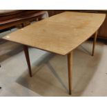 A 1960's shaped rectangular extending teak dining table by Mackintosh