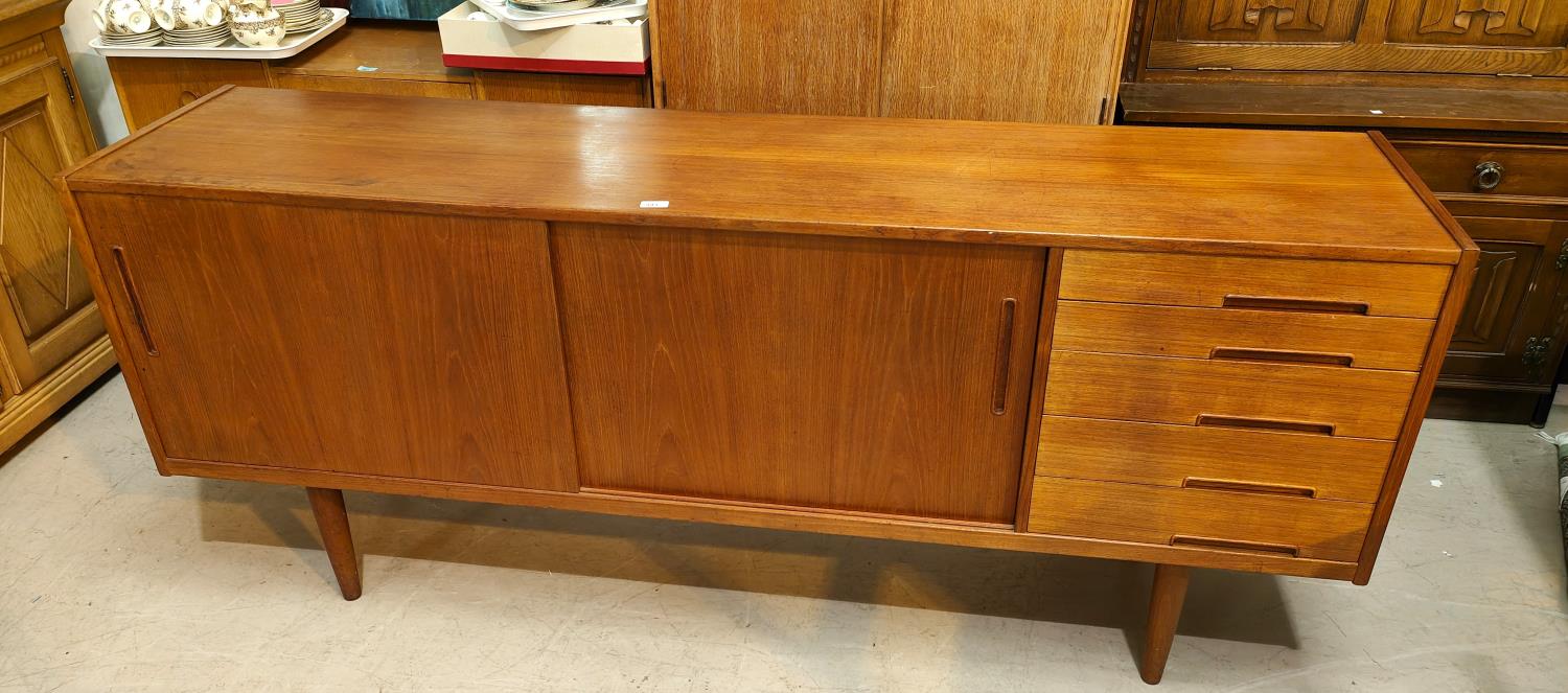 A 1960's G-Plan style teak sideboard with 2 sliding doors and 4 drawers - Image 2 of 4