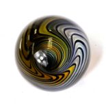 An unusual giant glass marble, with swirling vortex illusion inside, monogramed K to base,