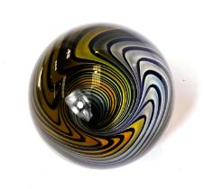 An unusual giant glass marble, with swirling vortex illusion inside, monogramed K to base,