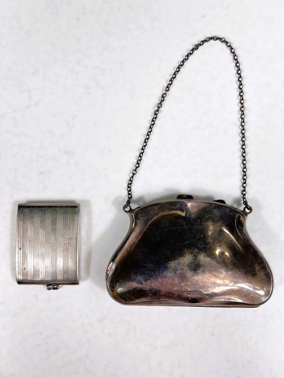 A hallmarked silver purse with chased ribbon and swag decoration, marks worn; an engine turned - Image 2 of 3