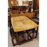 A 1960's teak dining suite comp. rectangular extending table, 6 chairs with wide top rails and