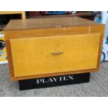 A vintage shop base unit with drawer lettered 'Playtex'