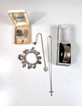 A silver char, bracelet, a cross on chain, a silver napkin ring, boxed etc