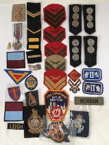 A collection of various military cloth shoulder badges, Military etc