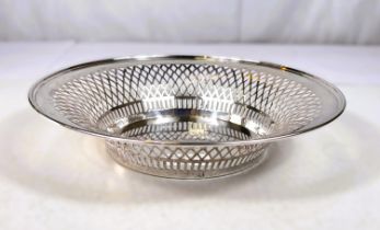 A circular hallmarked silver bowl with pierced rim, Birmingham 1909, 10oz, diameter 26cm monogrammed
