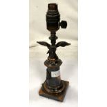 A bronzed table lamp in the form of eagle perched on column with squared base, height 29cm